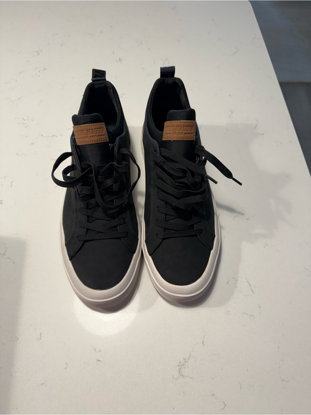 Steve Madden Black Sneakers with Brown Tongue Patch and White Sole